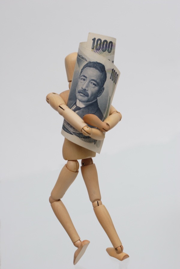 木偶人抱着的日元图片