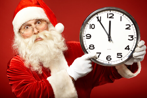 拿着钟表的圣诞老人图片